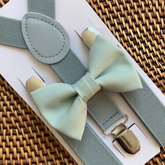 a bow tie and suspenders on a card