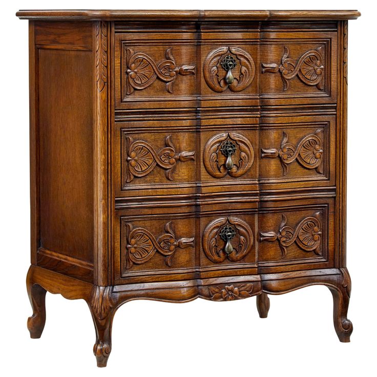 an old wooden dresser with ornate carvings on the top and bottom drawer, isolated against a white background