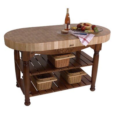 a wooden table with baskets and bottles on it's shelf next to an empty bottle