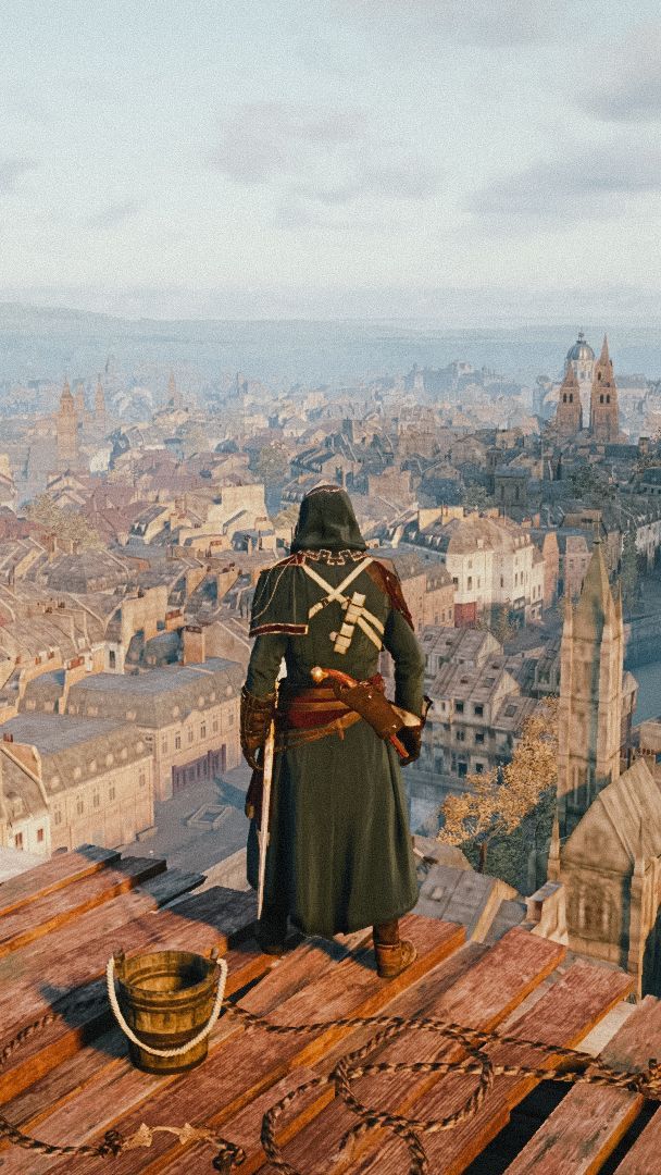 a man dressed in medieval clothing standing on top of a wooden platform overlooking a city