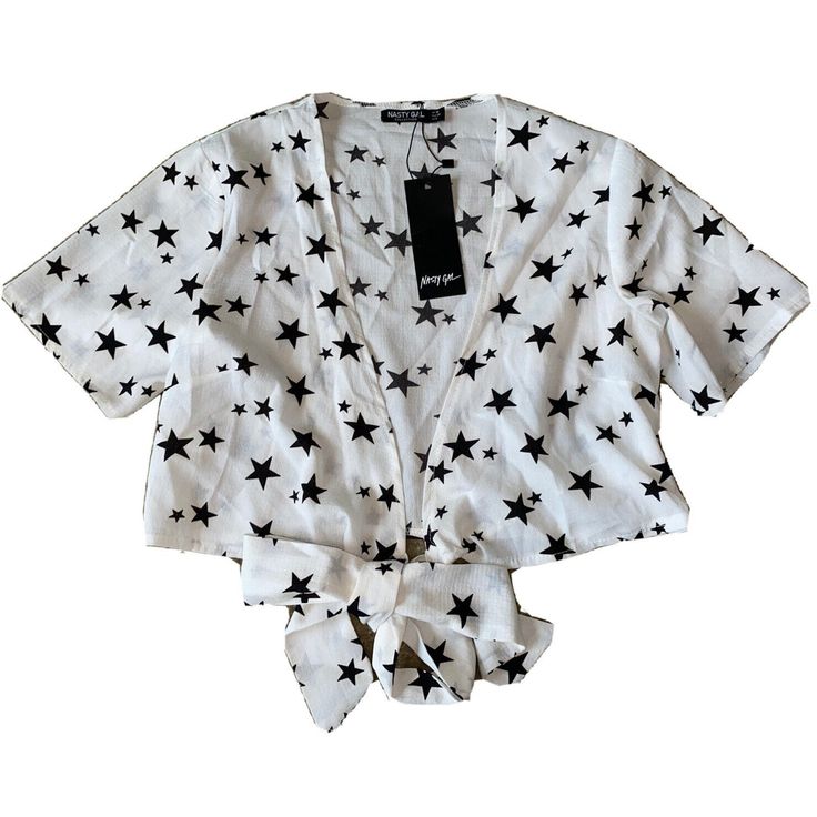 New Nasty Gal Collection Woman’s Crop Top Blouse Shirt White Black Stars Size 6. Super Cute Open Crop Top. Has A Large Tie In The Front Bottom. It Is White With Black Stars, “Out Of Space”. Please See Pictures For Details And Measurements. Casual V-neck Star Print Top, Trendy Spring Top With Star Print, Trendy Spring Star Print Top, Trendy Star Print Summer Tops, Trendy Star Print Tops For Summer, Trendy White Tops With Star Print, Casual Star Print V-neck Top, Cotton Summer Top With Star Print, White Star Print Top For Summer