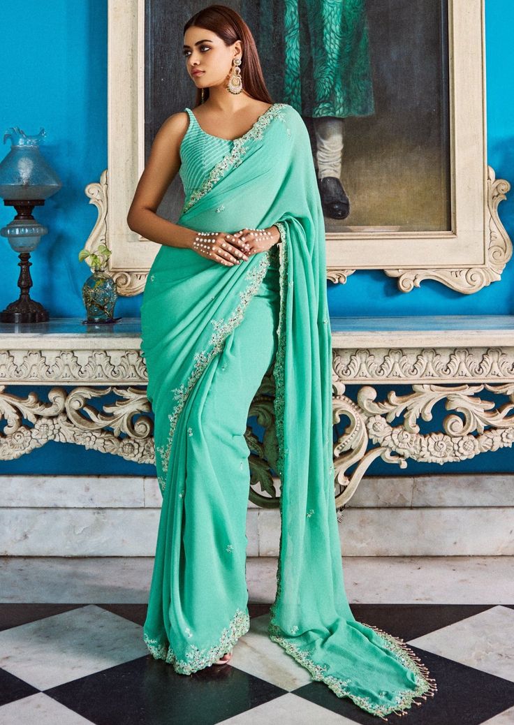 Sea green chiffon luckhnavi sari and blouse. Green Saree Outfit, Festive Silk Chiffon Saree Blouse Piece, Green Cutdana Pre-draped Saree, Festive Silk Chiffon Saree, Elegant Silk Chiffon Saree With Traditional Drape, Green Georgette Pre-draped Saree, Green Georgette Pre-draped Saree With Traditional Drape, Elegant Green Blouse With Sheer Dupatta, Designer Green Pre-draped Saree With Mirror Work