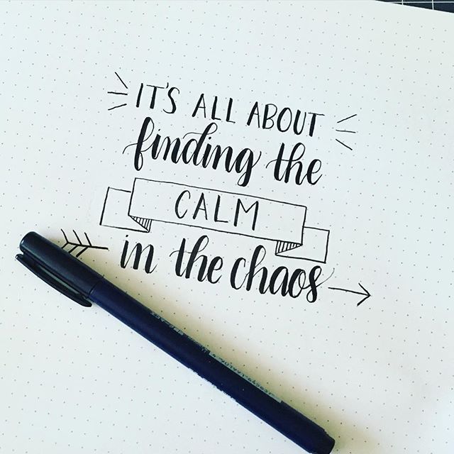 a notepad with the words it's all about finding the calm in the chaos