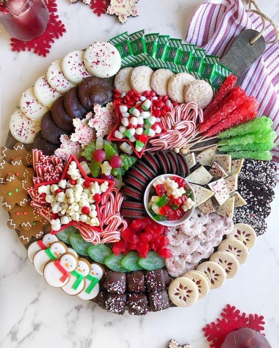 a platter filled with assorted candy and candies on top of a table