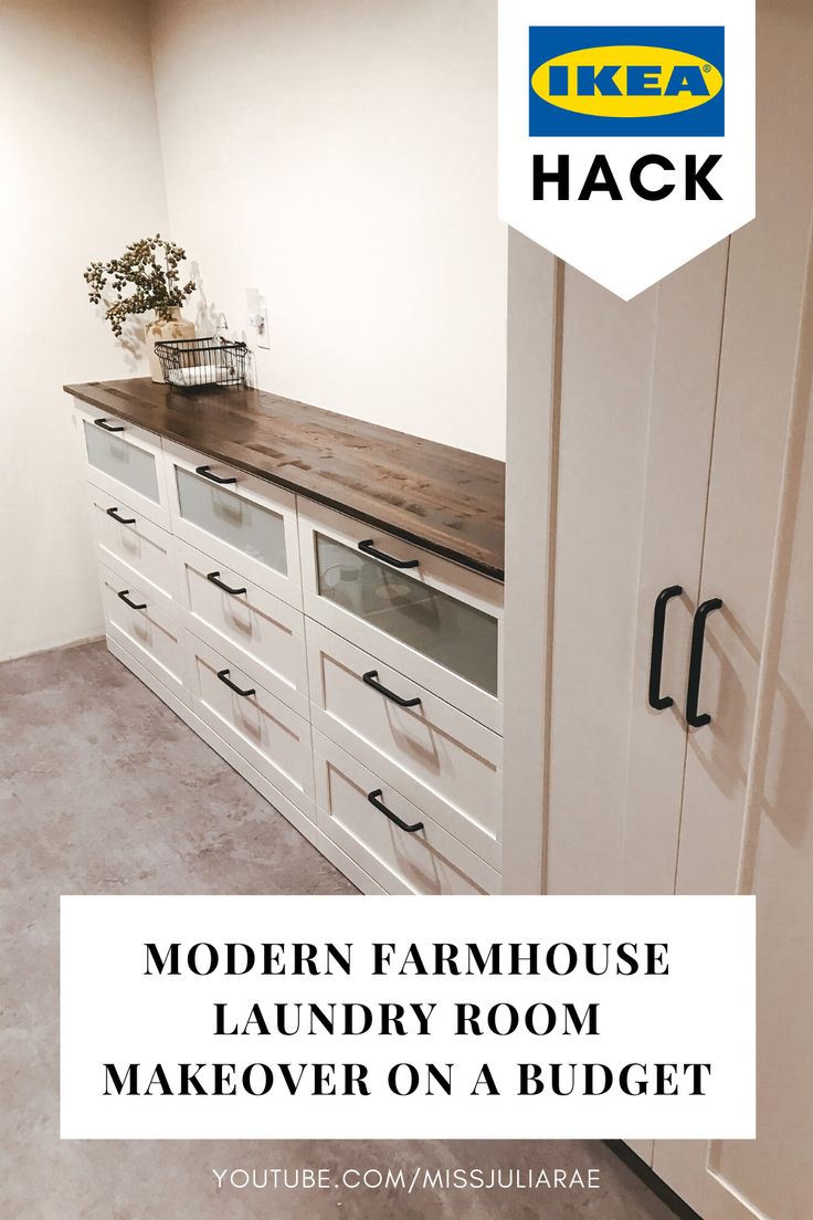 an empty room with white cabinets and drawers