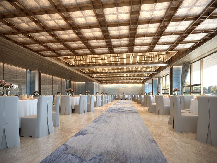 an empty banquet hall with white tables and chairs