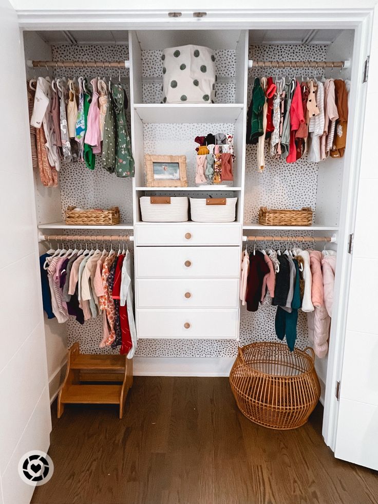 an organized closet with clothes and baskets