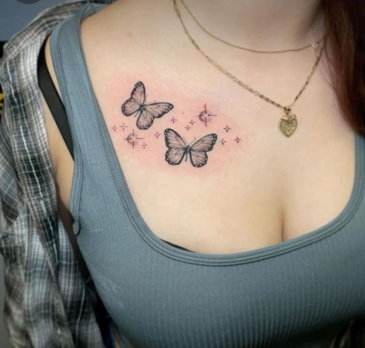 a woman with a butterfly tattoo on her chest