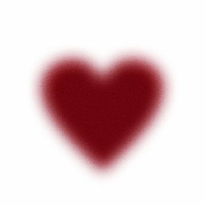 a red heart on a white background is shown in the center of this image, it appears to be blurry