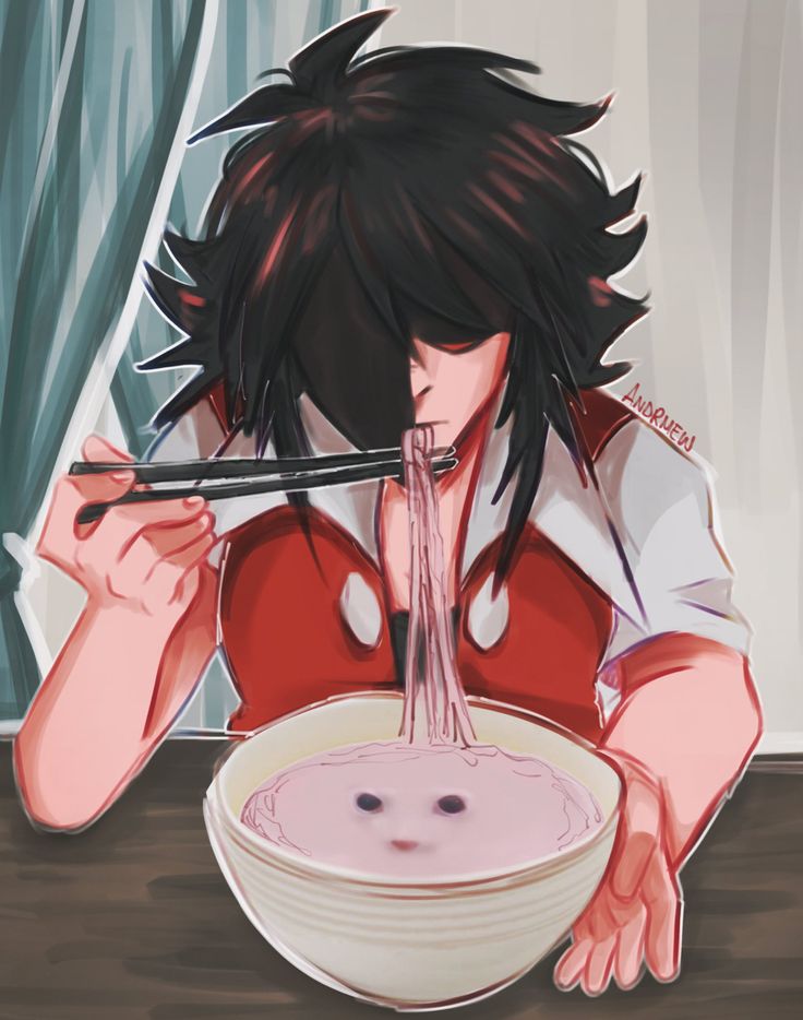 a person sitting at a table with a bowl of food and chopsticks in their hands