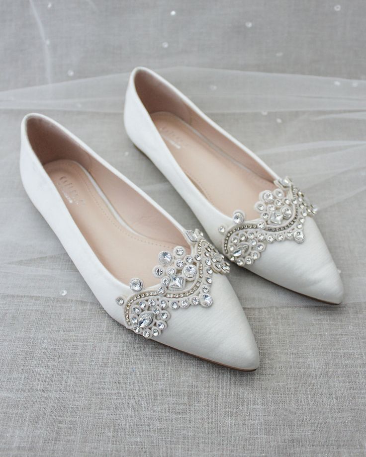 Inspired by a contemporary and refined designed ballet flat. This pointed toe satin flat embellished with rhinestones applique makes this shoe shine bright like a diamond. Choose from a subtle small touch of frost to an oversized bling. Perfect for brides, bridal party, bridesmaids, prom, parties, or any special occasion. DETAILS: COLORS AVAILABLE: Champagne, Ivory, Light Blue, Off White, Pink, Royal Blue, White UPPER: Synthetic upper and lining MATERIALS: Manmade outsole STYLE NAME: VANITA Classic Wedding Shoes, Wedding Shoes Sandals, Champagne Rose, Glitter Flats, Pointy Toe Heels, Wedding Flats, Pointy Toe Flats, Shoe Shine, Bridesmaid Shoes