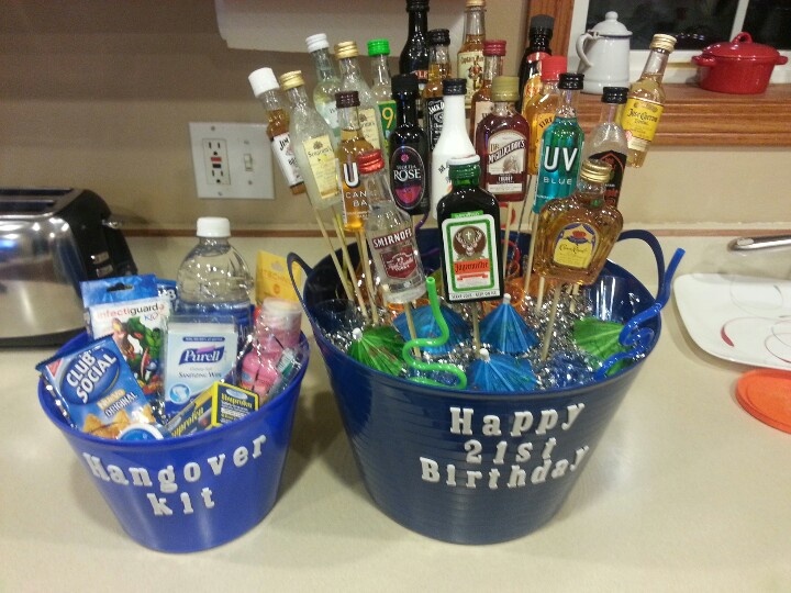 two blue buckets filled with alcohol bottles on top of a counter