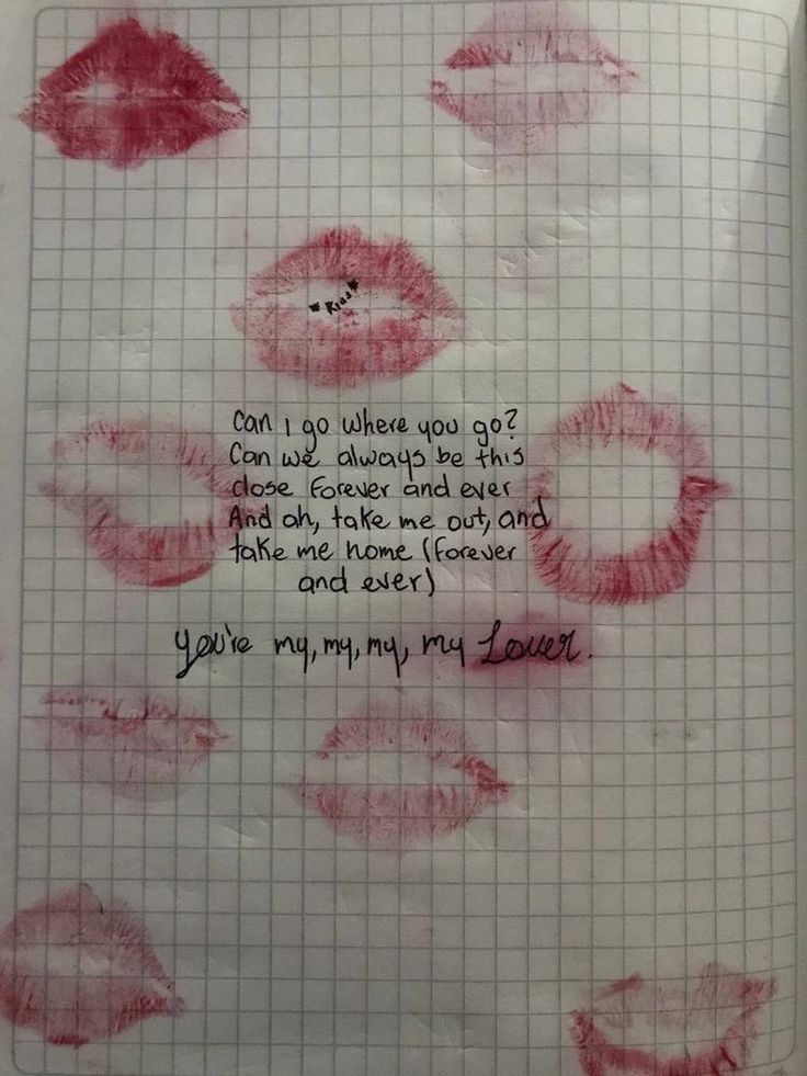 a piece of paper with writing on it and some red lipstick drawn on the sheet