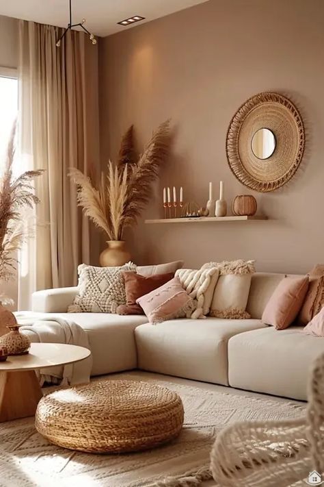 a living room filled with lots of furniture and pillows on top of a white rug