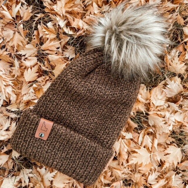 Wonderful knitted winter hats.  Perfect adult hat for warmth, comfort, and style.  This hat makes a practical and unique gift.  Complete with a leather tag and a pom pom.  Choose your favorite color and tag. Warm Crochet Hat For Outdoor Fall Activities, Warm Crochet Hat For Outdoor Fall Use, Brown Warm Hats For Everyday, Brown Beanie For Cold Weather In Fall, Warm Brown Hat For Everyday, Adjustable Brown Beanie For Winter, Brown Crochet Hat For Cold Weather In Fall, Brown Everyday Beanie, One Size Fits Most, Brown Crochet Hat For Fall