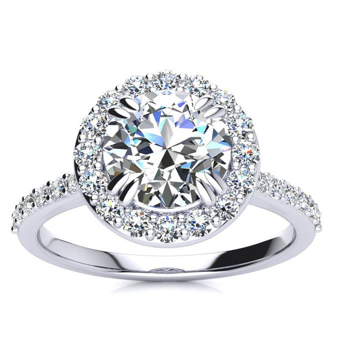 a white gold engagement ring with an oval cut diamond surrounded by pave set diamonds