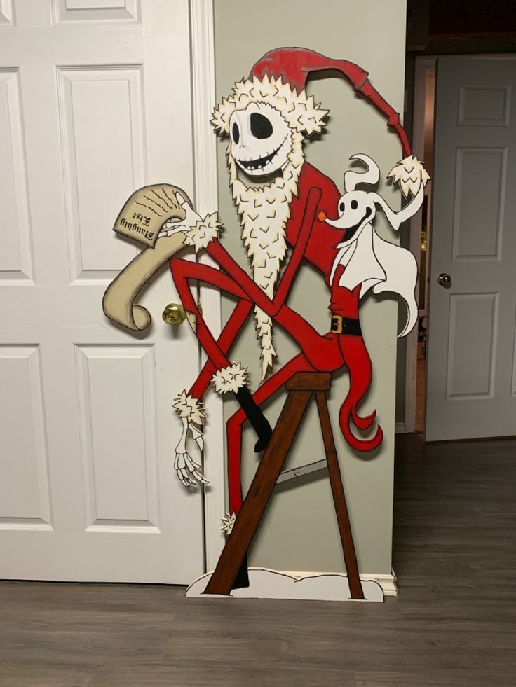 a paper cut out of a skeleton holding a sign with a dog on it's back