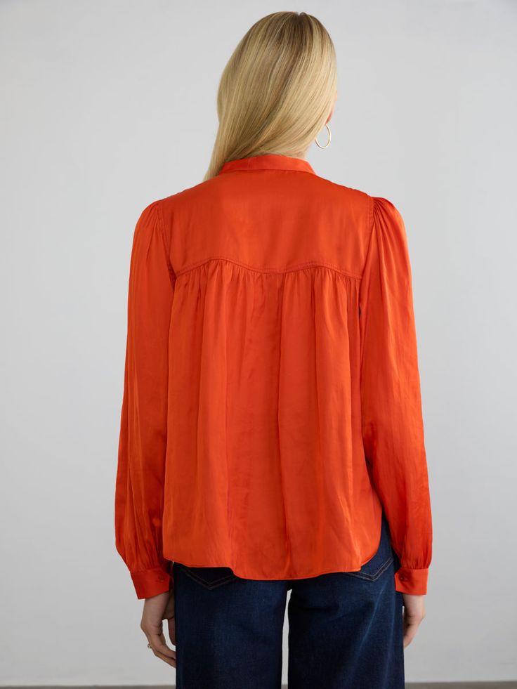 Description:The Roisin blouse is a refined popover top crafted from our wrinkle-resistant Japanese satin. It features full-length, voluminous sleeves, finished with matching natural shell buttons at the cuffs. The front and back yoke has subtle gathering, adding graceful movement and comfort. This blouse looks polished whether worn loose or tucked into pants. Tuck into the Pleated Pull-on Pants for a flowy chic presentation. Size Fit:Model (5’9”) wears a size small Length: 25 1/4"Chest: 20"Sleev Balloon Sleeve Tops With Button Closure For Work, Silk Button-up Tops For Fall, Fall Silk Button-up Tops, Classic Blouse With Balloon Sleeves And Button Cuffs, Fall Long Sleeve Shirt With Pleated Sleeves, Collared Tops With Pleated Sleeves For Fall, Fall Pleated Long Sleeve Shirt, Fall Lantern Sleeve Blouse With Button Closure, Silk Button-up Blouse