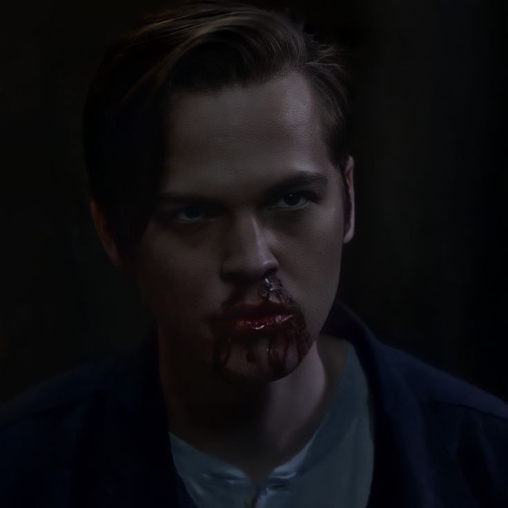 a man with blood on his face and nose