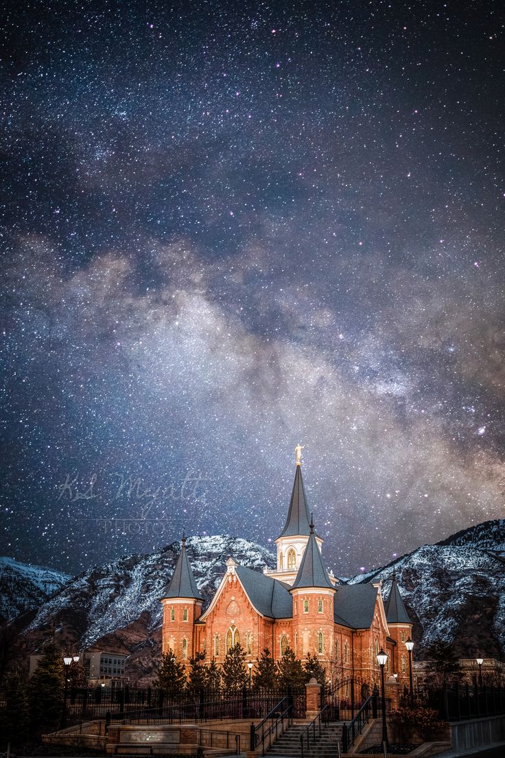 an old building with a steeple under the night sky and stars in the background