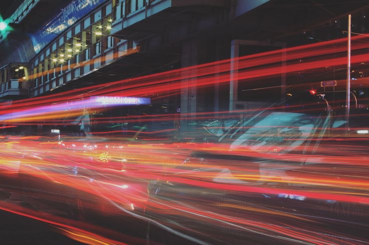 blurry photograph of city traffic at night