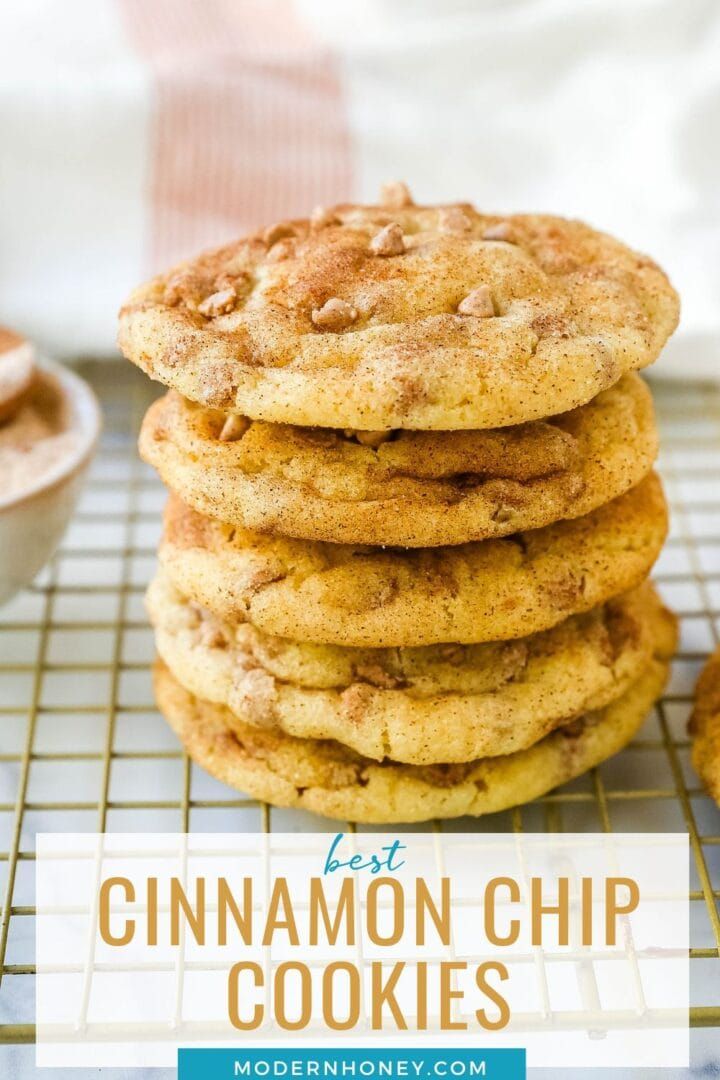 a stack of cinnamon chip cookies sitting on top of a cooling rack