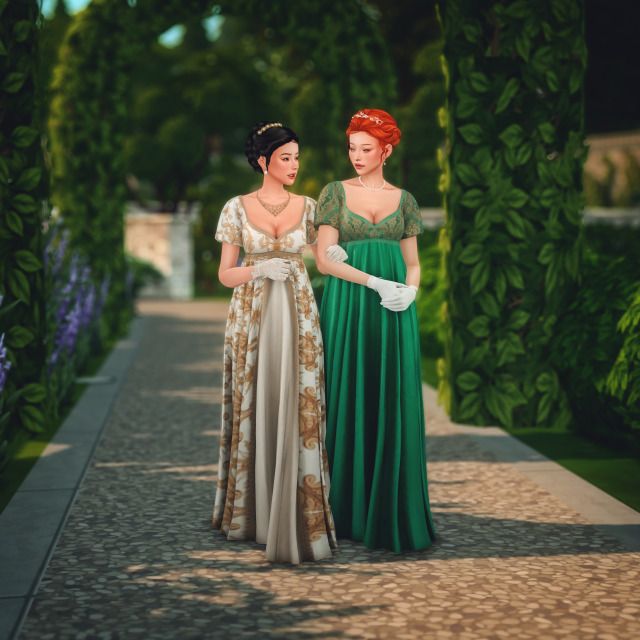 two women standing next to each other in front of green trees and bushes, both wearing evening gowns