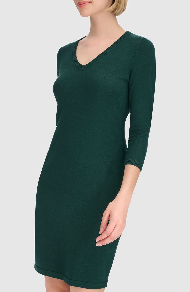 Enjoy the versatility of this V-neck sweater-dress knit from soft, lightweight yarns in a stretchy body-con silhouette. 36" length Slips on over head V-neck Three-quarter sleeves Unlined 75% rayon, 25% nylon Machine wash, line dry Imported Solid V-neck Bodycon Dress For Winter, V-neck Bodycon Dress For Winter, Green V-neck Dress For Fall, Casual Seamless V-neck Dress, Stretch V-neck Mini Dress For Fall, Calvin Klein Stretch Bodycon Dress, Calvin Klein Stretch Mini Dress, Casual V-neck Seamless Dress, Stretch V-neck Midi Dress For Winter