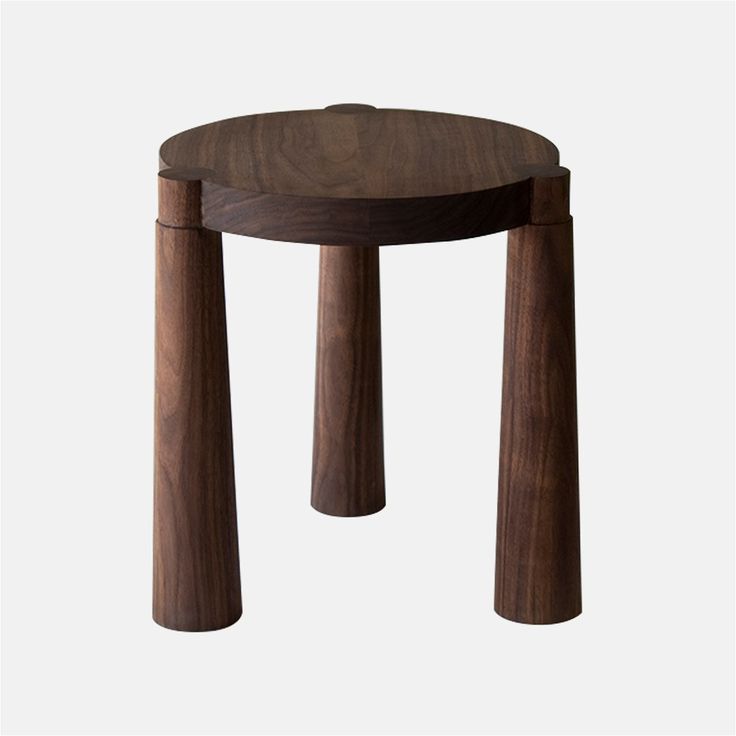 a small wooden stool with two legs on the bottom and one leg in the middle