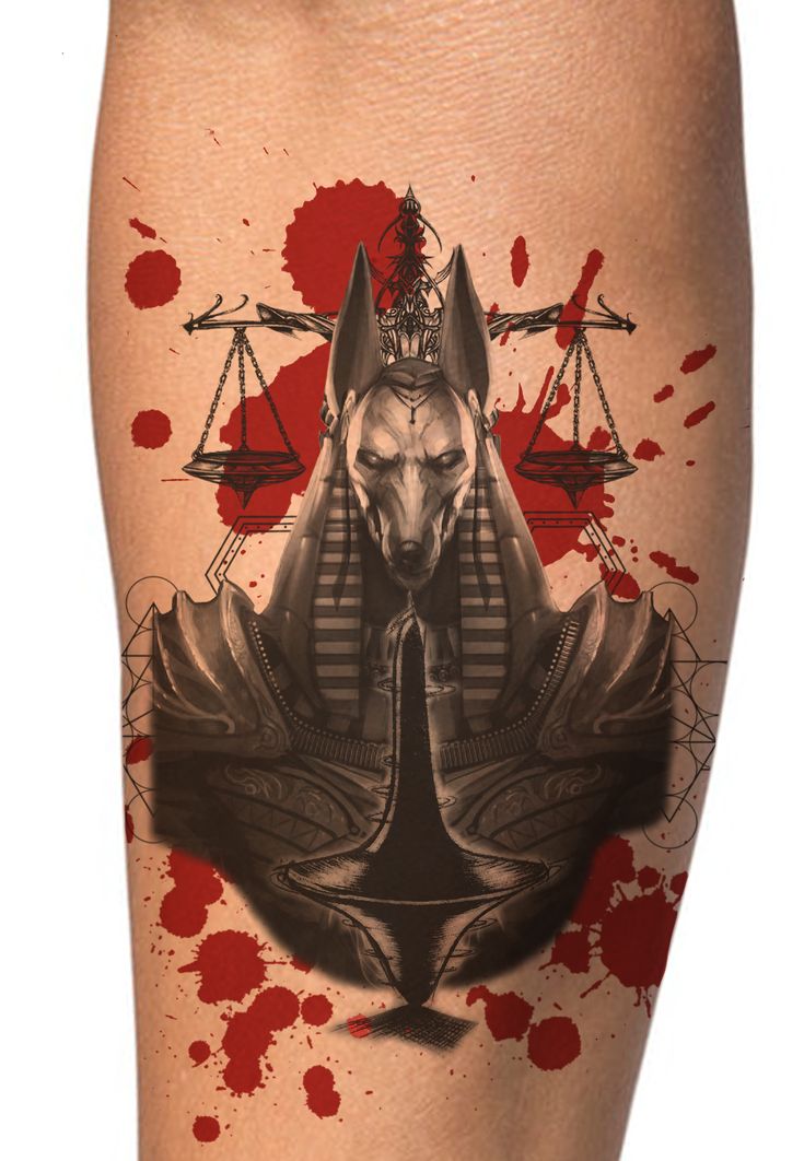 an egyptian tattoo with blood splattered on it