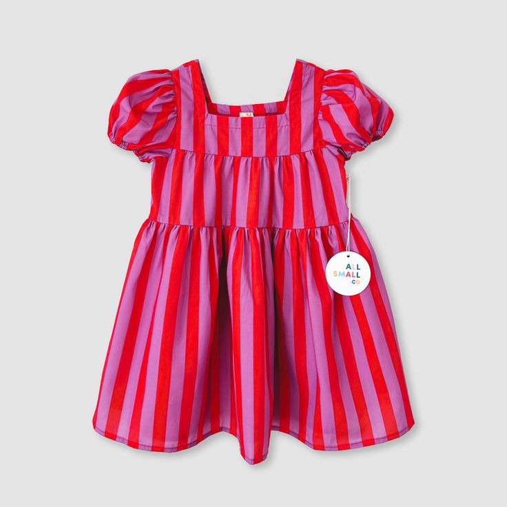 Small will be the star of the show - or should we say circus?! Look absolutely adorable at your next event wearing our Pink Stripe Tier Dress with its pink stripes, 3-tier design, puff sleeves, and midi length. Perfect for any season, so no need to clown around when it comes to being a style icon.  65% Cotton 35% Polye Cute Clown Dress, Pink Clown Dress, Cute Striped Dress For Playtime, Playful Cotton Twirl Dress For Playtime, Circus Dress, Bright Childrens Dress, Tier Dress, Perfect Wardrobe, Sweater Set