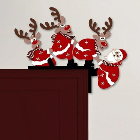 some reindeers are standing on top of a cabinet