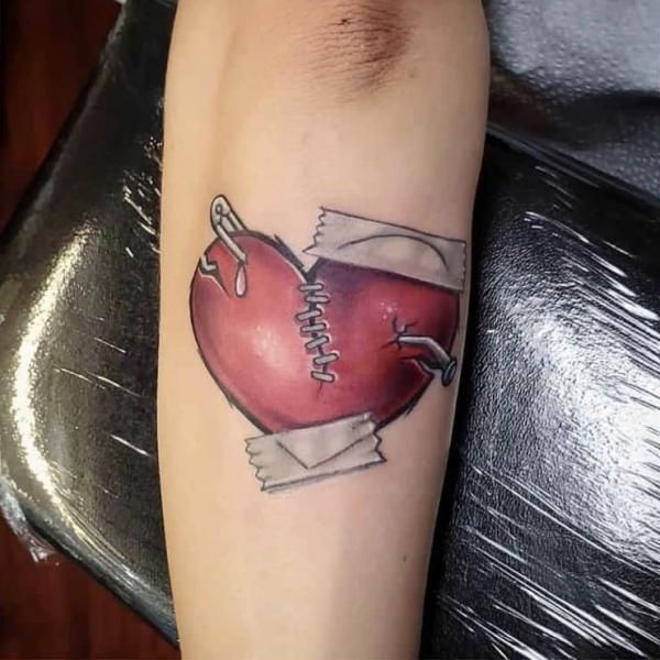 For some, these stories are best told through ink on skin—a broken heart tattoo. But let’s not dwell in the past. Let's dive into the diverse ways a Safety Pin Tattoo, Heart Tattoo Ideas, Heart With Wings Tattoo, Web Tattoo, Heart Tattoos, Tattoo Now, Heart Break, Forearm Tattoo Women, Heart Tattoo Designs