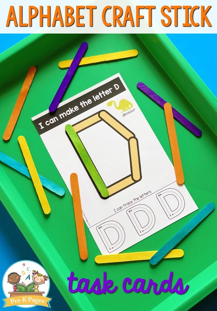 an alphabet craft stick with the letters d and d in it on a green tray