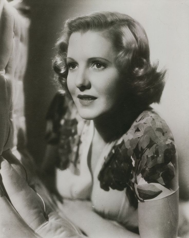 an old black and white photo of a woman