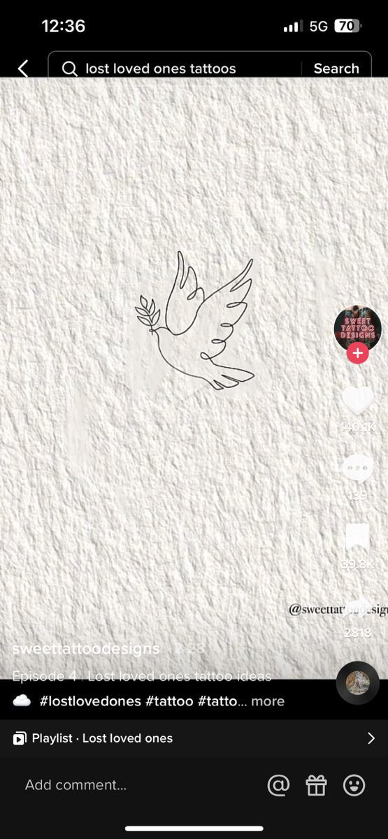 a bird flying over a white wall with the word love written on it