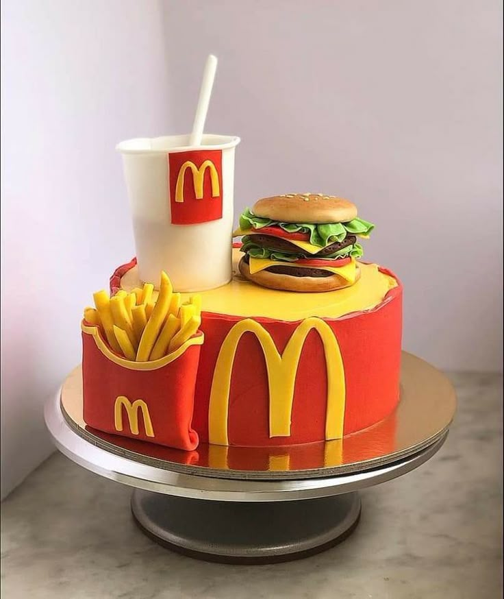 a mcdonald's cake with a hamburger and fries on it