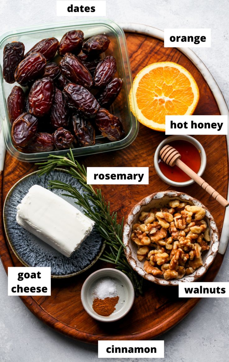 an assortment of food that includes dates, oranges and rosemary