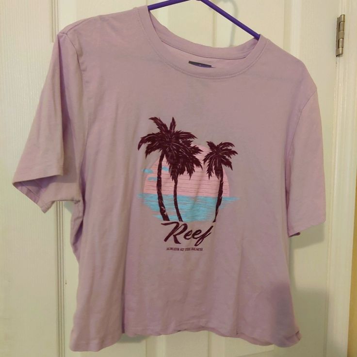 Reef Crop T-Shirt Size Xl. Super Soft, Light Purple Crop T-Shirt From Reef. Brand New Without Tags Purple Graphic Tee With Relaxed Fit, Casual Purple Short Sleeve Top, Purple Screen Print Short Sleeve Top, Purple Short Sleeve Top With Screen Print, Short Sleeve Cropped T-shirt With Screen Print, Casual Short Sleeve Tops With Front Print, Purple Graphic Tee Cotton Top, Purple Cotton Graphic Tee, Purple Crew Neck Graphic Tee