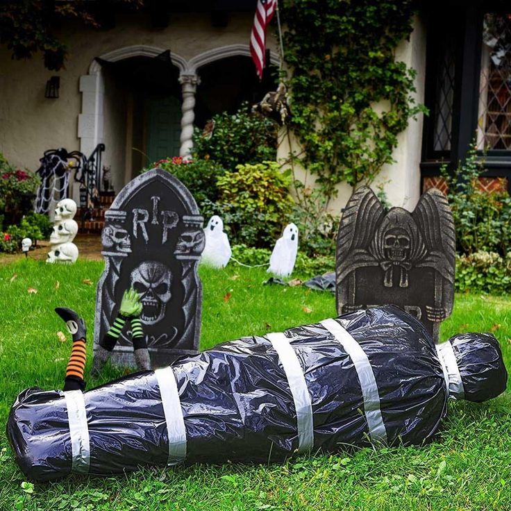 a cemetery with tombstones and decorations in the grass