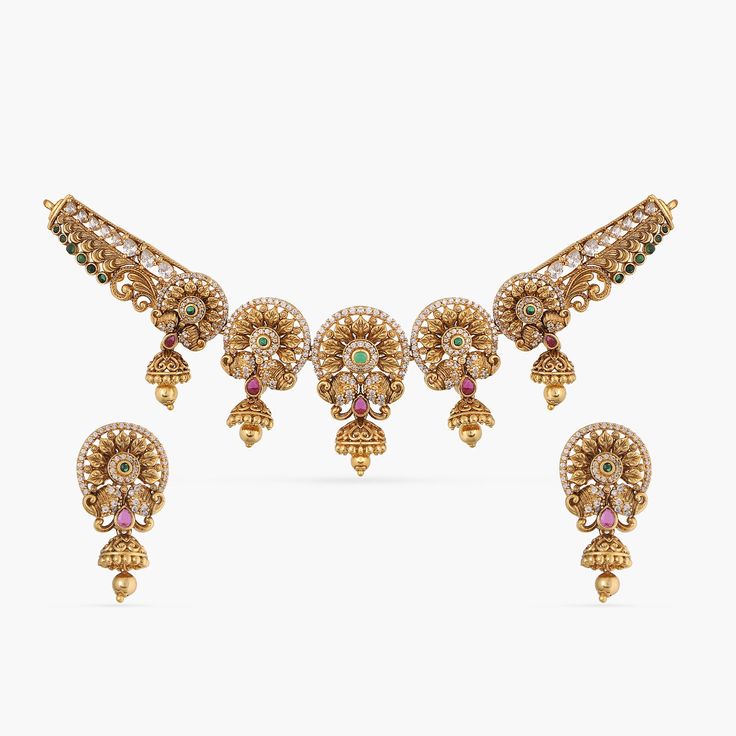 Shauri Antique Necklace Set Festive Kundan Necklace In Antique Gold, Festive Kundan Antique Gold Necklace, Antique Gold Temple Jewelry Necklace For Festive Season, Antique Gold Necklaces For Festive Celebrations, Heavy Ornate Necklace For Festive Occasions, Antique Gold Necklace For Festive Celebrations, Antique Gold Necklace For Diwali Festive Season, Festive Antique Gold Necklaces For Diwali, Festive Antique Gold Temple Jewelry Necklace