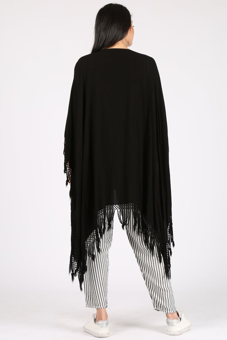 A light take on the poncho, this versatile piece can also act as a shawl and beach coverup. Please note this style is unisex. Fabric Content: 60% Cotton, 40% Rayon, made in Morocco. Sizing: O/S Fringe Poncho, Fringe Kimono, Fringed Poncho, Tulum, Santorini, One Size Fits All, Yellow White, Morocco, Shawl