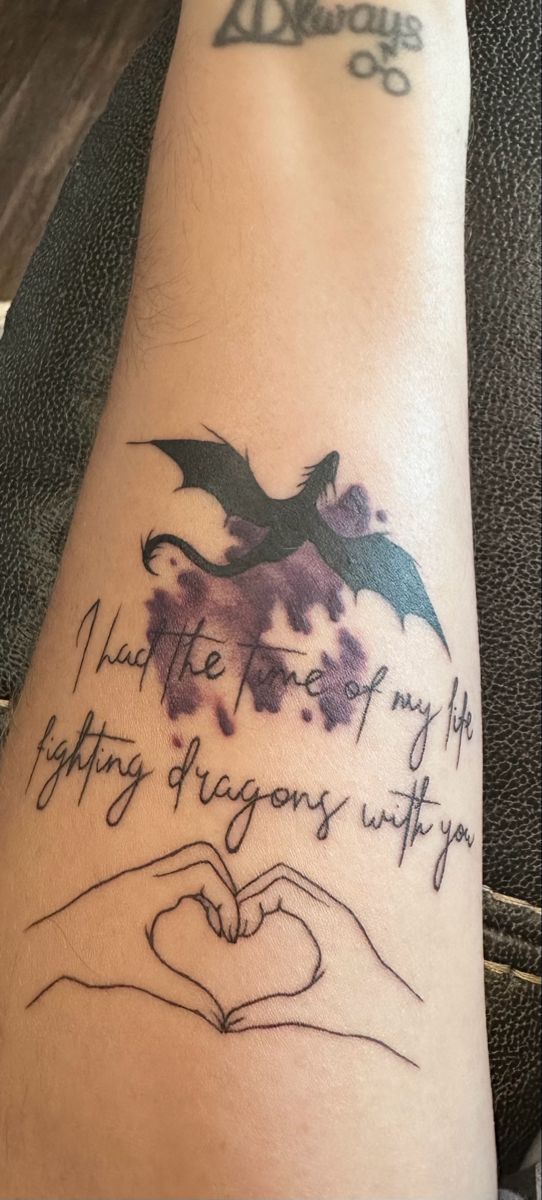 a tattoo on the arm that reads, what the hell is my happy dragon with you