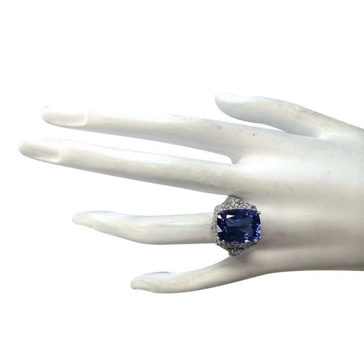 Stamped: 14K White Gold Total Ring Weight: 7.5 Grams Ring Length: N/ARing Width: N/A Gemstone Weight: Total Natural Tanzanite Weight is 8.14 Carat (Measures: 14.10x10.95 mm) Color: Blue Diamond Weight: Total Natural Diamond Weight is 1.00 Carat Quantity: 54 Color: F-G, Clarity: VS2-SI1 Face Measures: 16.60x14.95 mm Sku: [702338W] Formal Fine Jewelry Sapphire Cushion Cut Ring, Formal Cushion Cut Sapphire Ring, Cushion Cut Gemstones With Accent Stones For Formal Occasions, Formal Cushion Cut Gemstones With Accent Stones, Cushion Cut Gemstones With Prong Setting For Formal Occasions, Elegant Multi-stone Platinum Gemstones, Formal Multi-stone Topaz Ring In White Gold, Formal Tanzanite Ring In Fine Jewelry Style, Formal White Gold Multi-stone Topaz Ring