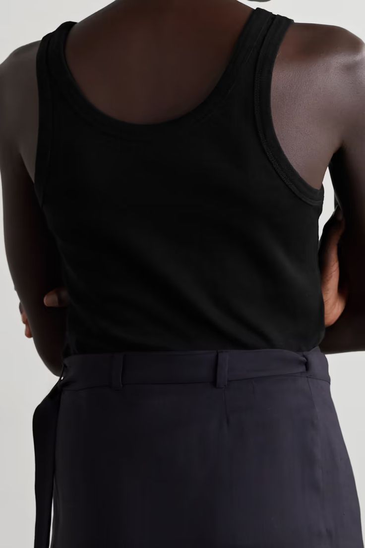 THE ROW Frankie organic cotton-jersey tank | NET-A-PORTER Classic Black Tank Top, Classic Black Cotton Tank Top, Fitted Cotton Tank Top For Work, Cotton Tank Vest For Work, Classic Cotton Tank Top For Work, Black Cotton Tank Top For Layering, Silk Tank Top, Silk Tank, A Skirt