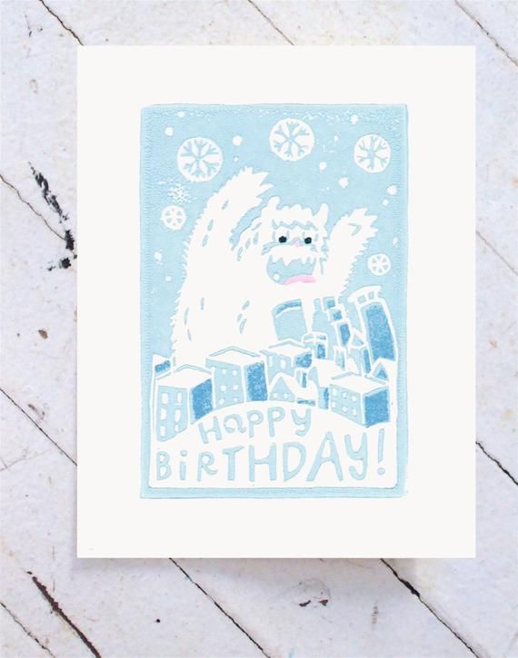 a blue and white birthday card with an image of a furry animal on it's back