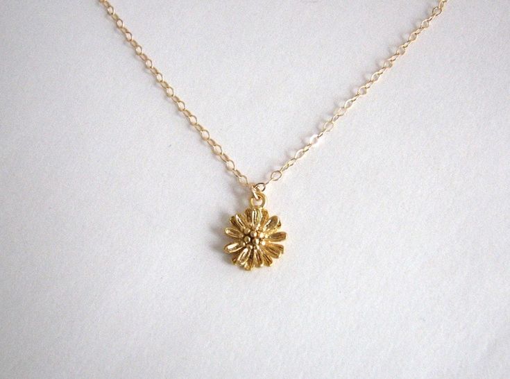 A small gold flower with lots of detail is hung on a delicate yet sturdy 14K Gold-Filled Chain. Sweet and simple. Feminine and charming. - Pendant - 14k Gold plated Brass - 9mm in diameter - Chain + components - 14K Gold-Filled - Clasp - 14K Gold-Filled lobster clasp . . . . . . . . . . . . . . . . . . . . . . . . . . . . . . . . Want more for bridesmaids, sisters or friends? I am happy to put custom orders together! . . . . . . . . . . . . . . . . . . . . . . . . . . . . . . . . Necklace arrive Yellow Gold Flower Charm Necklace For Wedding, Yellow Gold Flower Necklace With Charm For Wedding, Yellow Gold Flower Necklace For Wedding, Dainty Yellow Gold Necklace With Flower Charm, Dainty Gold Jewelry With Flower Decoration, Dainty Gold-plated Flower Necklace, Gold Flower Necklace For Anniversary, Delicate Yellow Gold Flower Necklace, Gold Dainty Flower Pendant Necklace