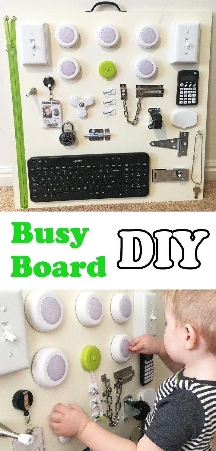 a young boy is playing with a busy board diy set up on the wall