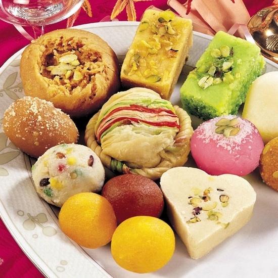 a white plate topped with lots of different types of pastries