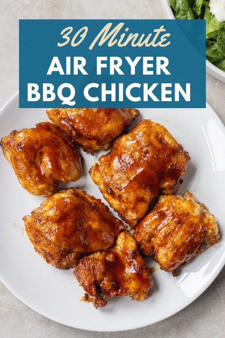 air fryer bbq chicken on a white plate with lettuce in the background